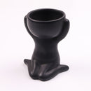 Vaso Decorativo de Cerâmica em forma de figura humana, ideal para decorar ambientes com estilo e elegância.