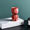 Vaso Decorativo de Cerâmica em formato de figura humana, ideal para decoração de interiores.